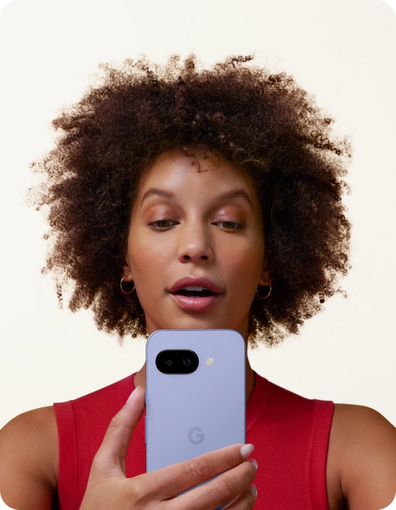 Woman looking at her Google Pixel 9a